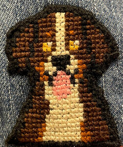Cross-stitch patch of a Bernese Mountain dog